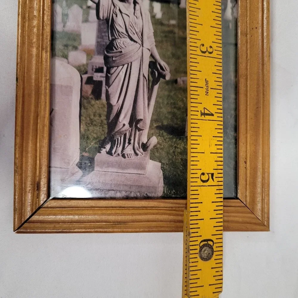 Wooden Frame with Statue Photograph